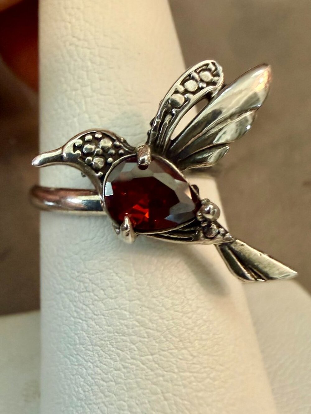 925 sterling silver hummingbird ring featuring a teardrop-shaped red garnet